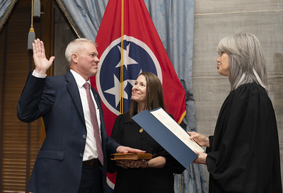 Judge Steven W. Sword is sworn in by Chief Justice Holly Kirby