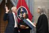 Judge Steven W. Sword is sworn in by Chief Justice Holly Kirby